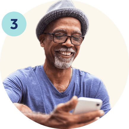 man looking at phone and smiling